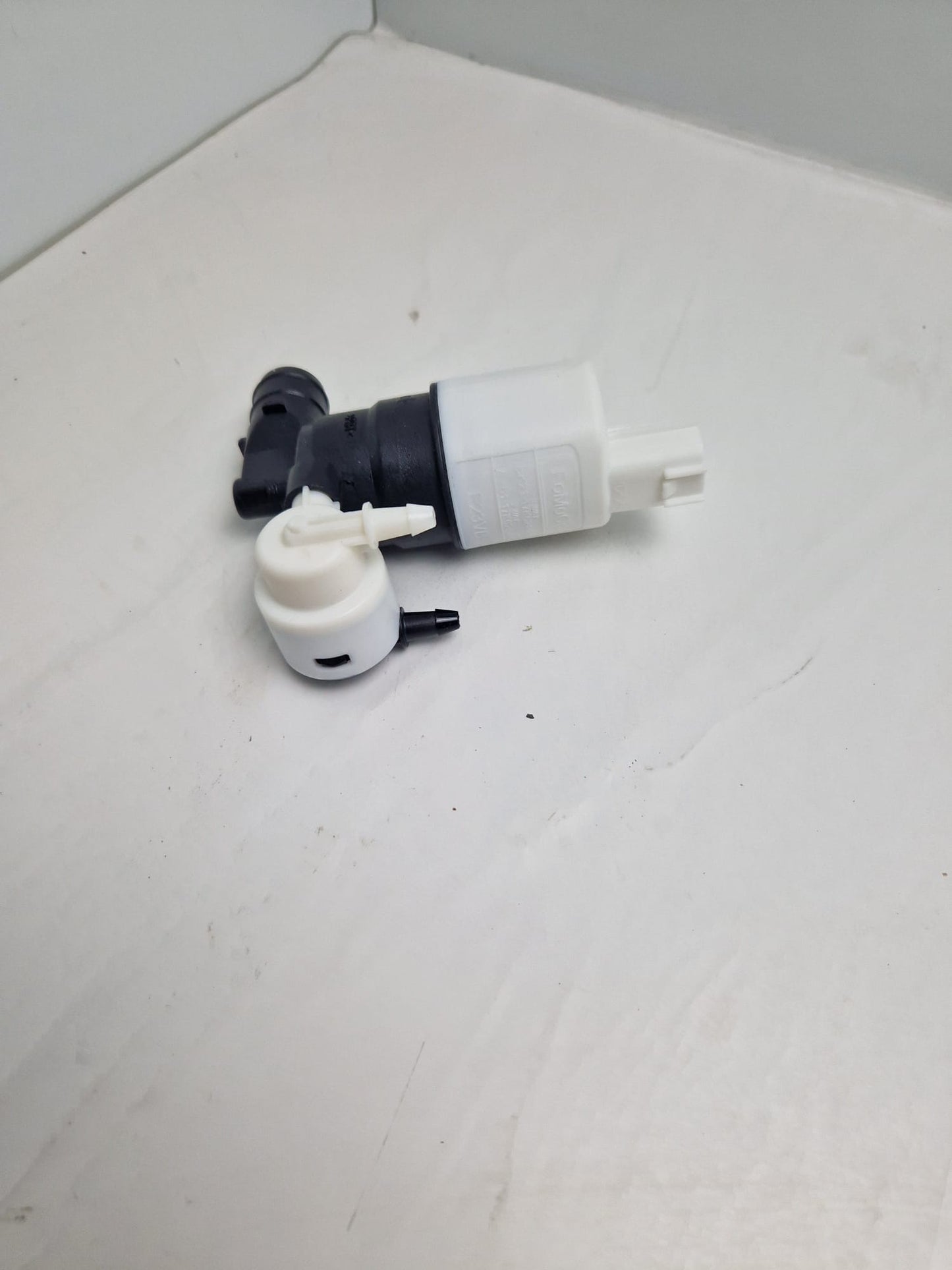 Windshield washer pump SEIM Z113959, FOMOCO E23VB, FEBI 103391  (Request price)