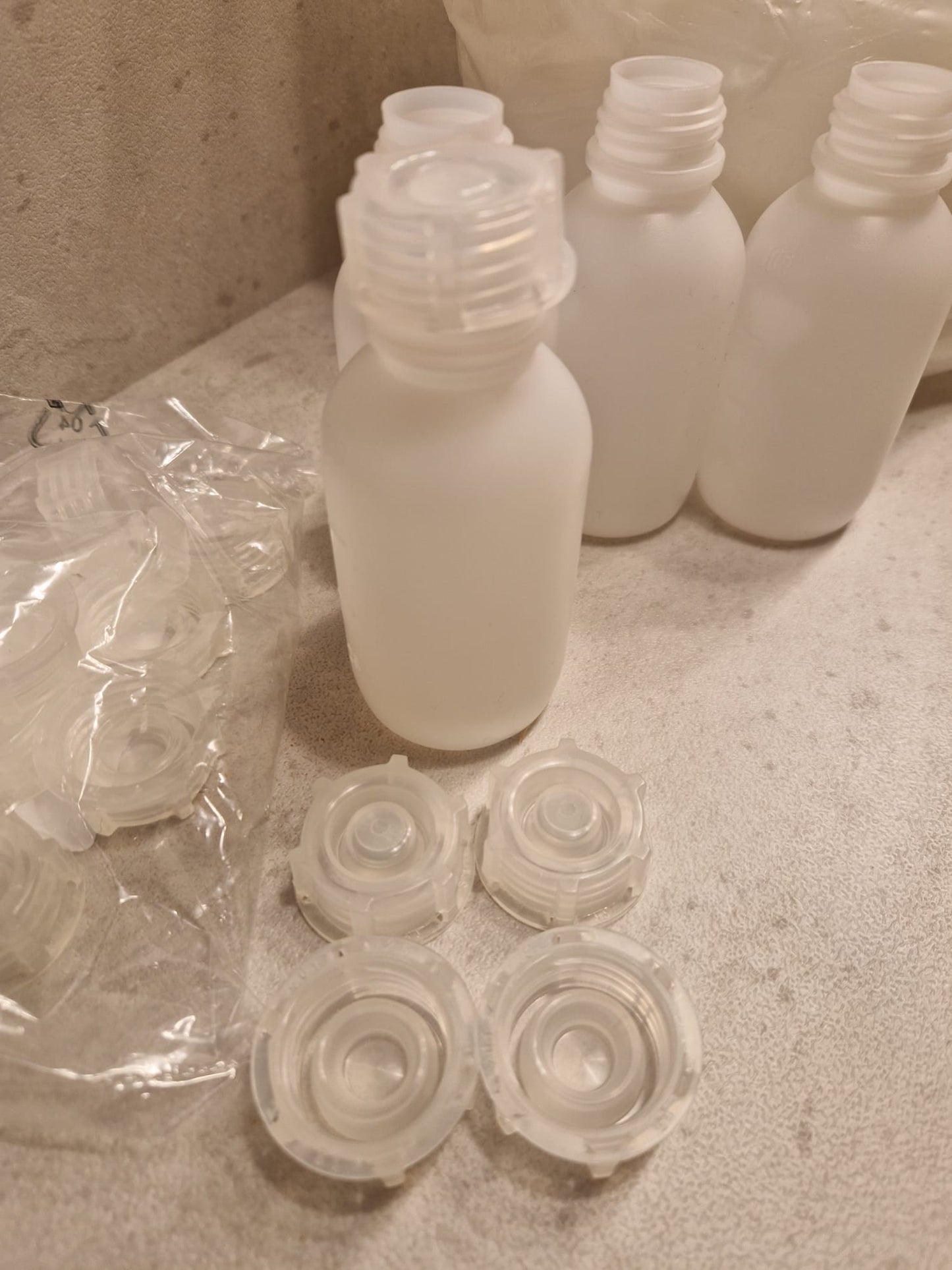 Kautex™ medium-wide neck bottle made of high-density polyethylene, with caps, 100 ml, 19 mm  (Request price)