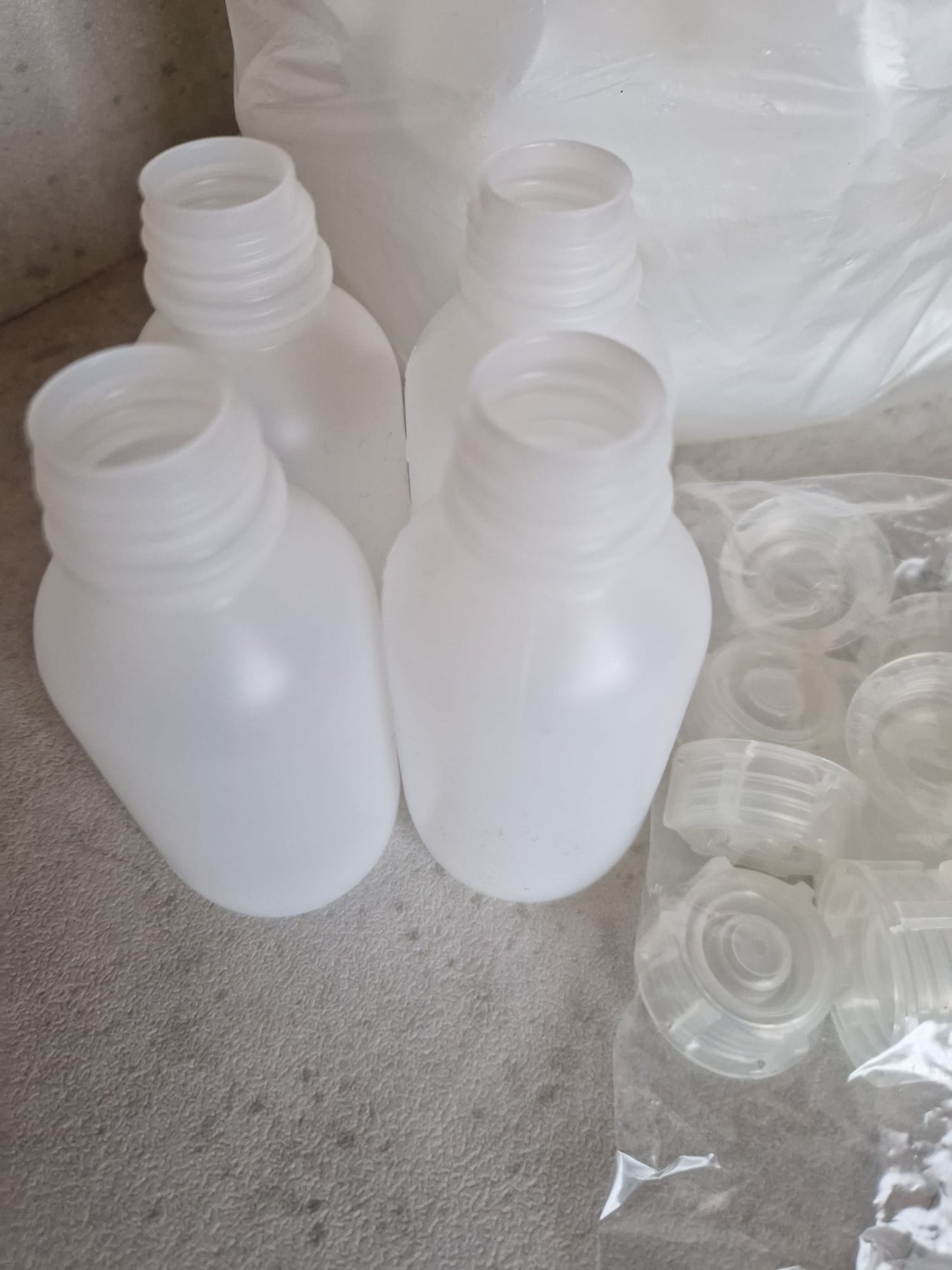 Kautex™ medium-wide neck bottle made of high-density polyethylene, with caps, 100 ml, 19 mm  (Request price)