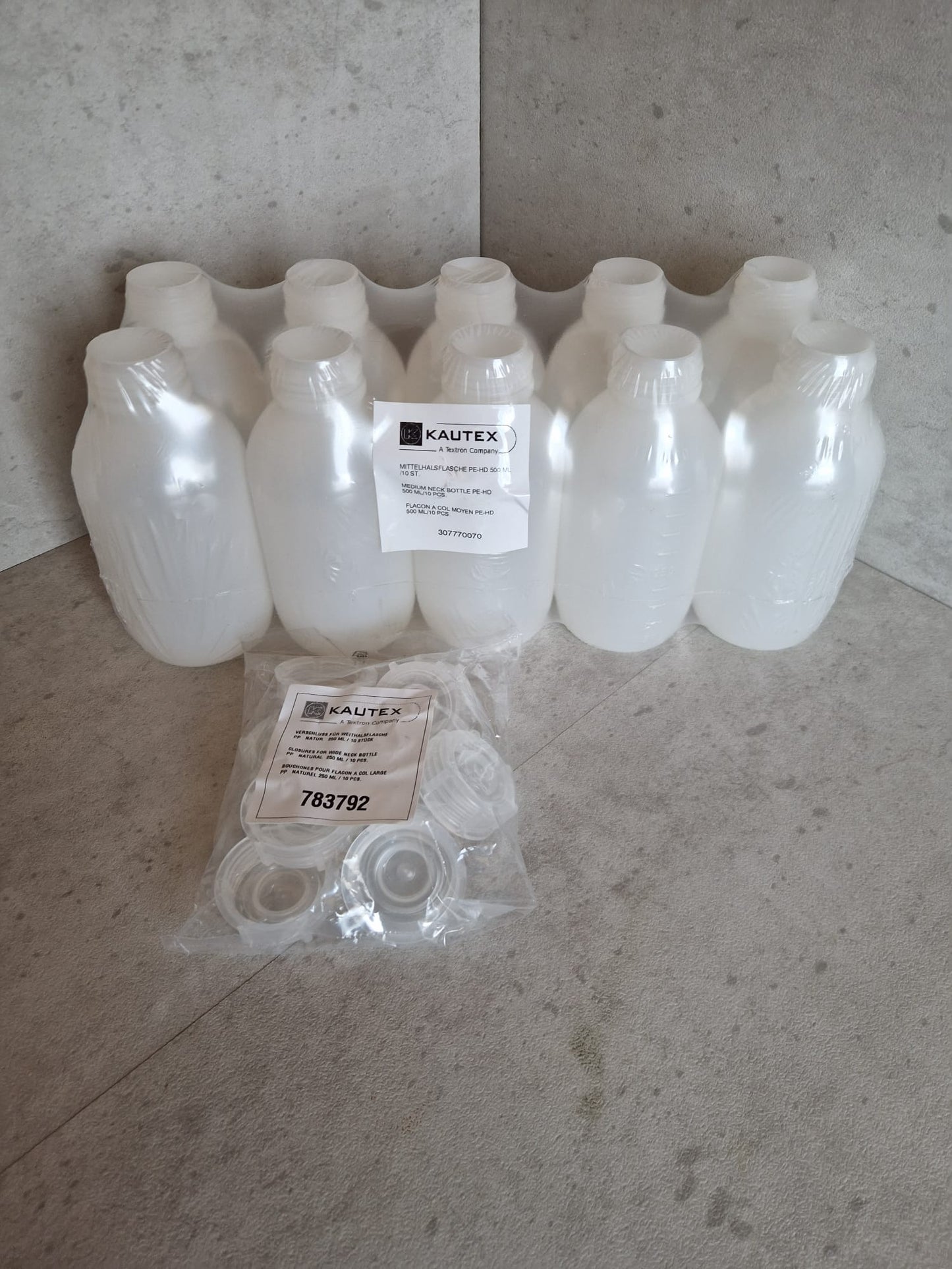 Kautex™ medium-wide neck bottle made of high-density polyethylene, with caps, 500 ml, 30.8 mm  (Request price)