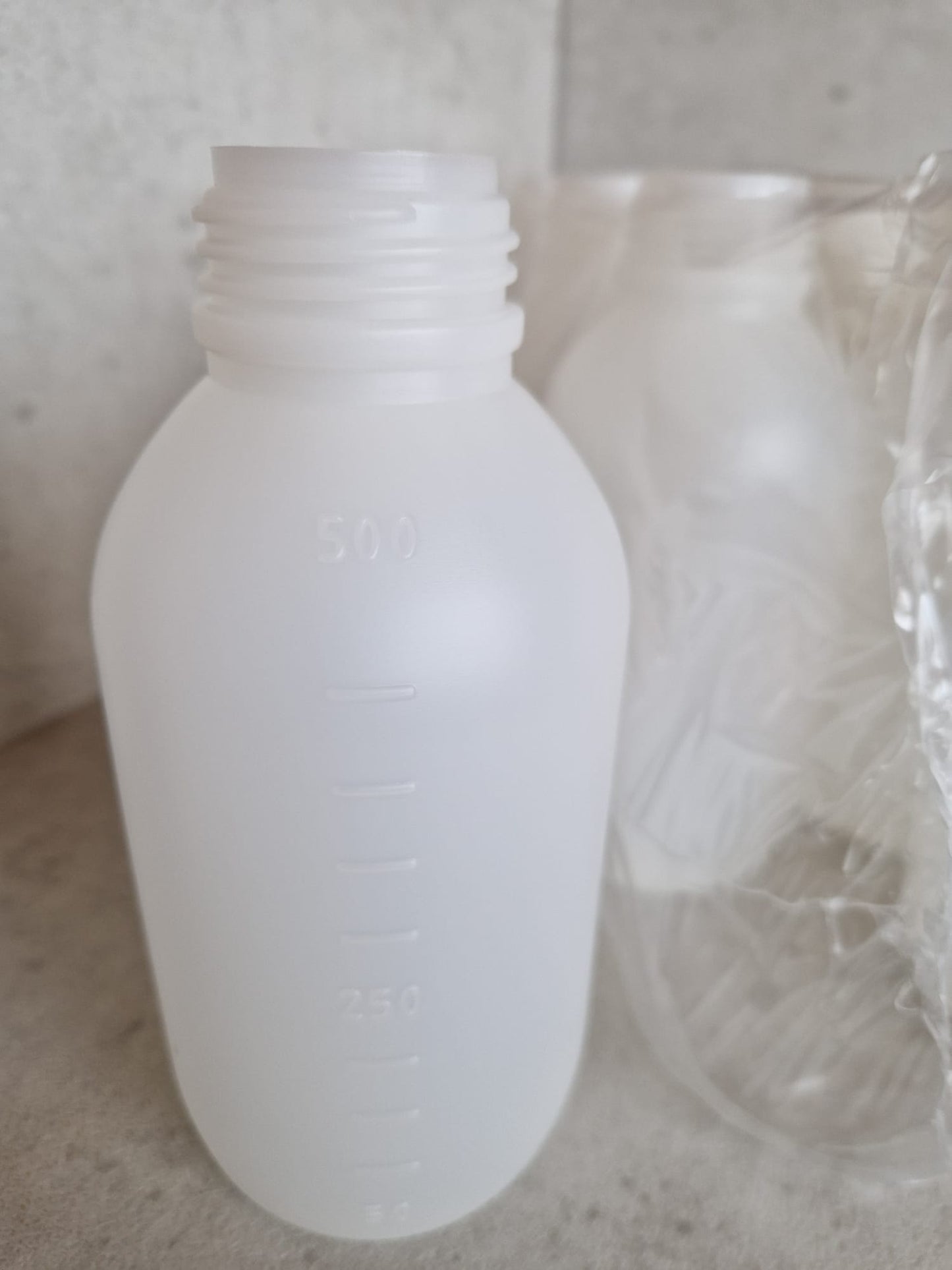Kautex™ medium-wide neck bottle made of high-density polyethylene, with caps, 500 ml, 30.8 mm  (Request price)