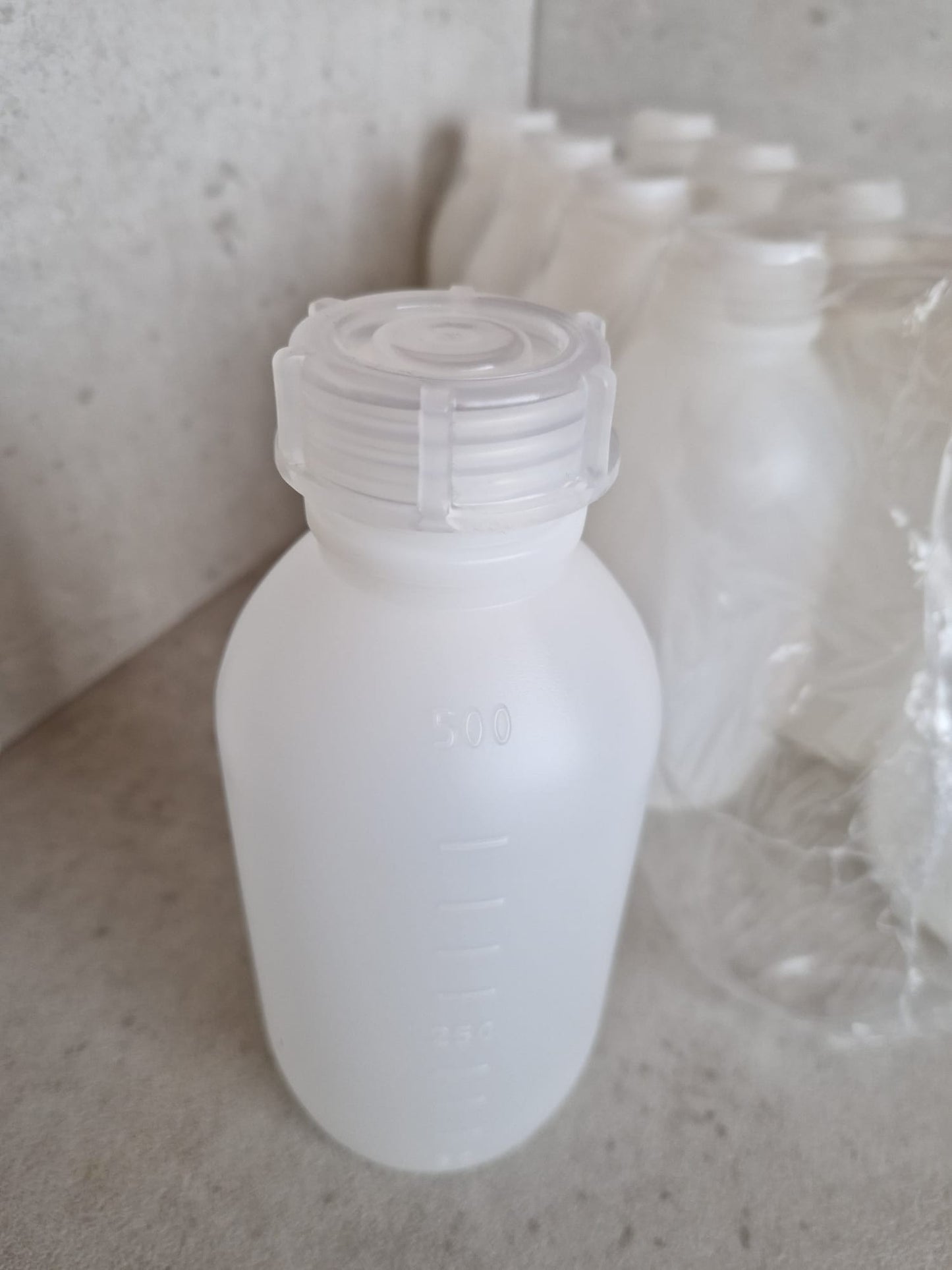 Kautex™ medium-wide neck bottle made of high-density polyethylene, with caps, 500 ml, 30.8 mm  (Request price)